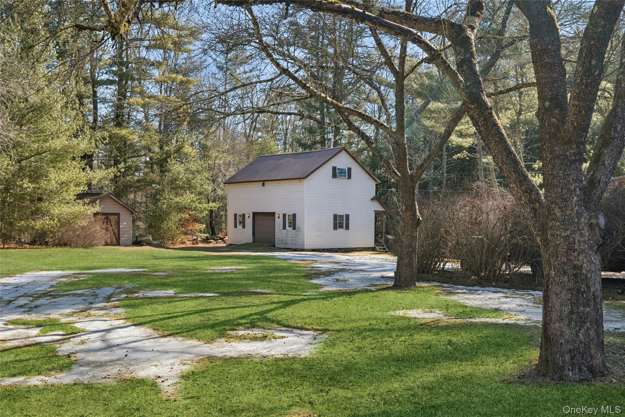 37 Nober Strunk Road Narrowsburg, NY 12764 - Photo 36 of 50 a front view of a house with a yard and trees
