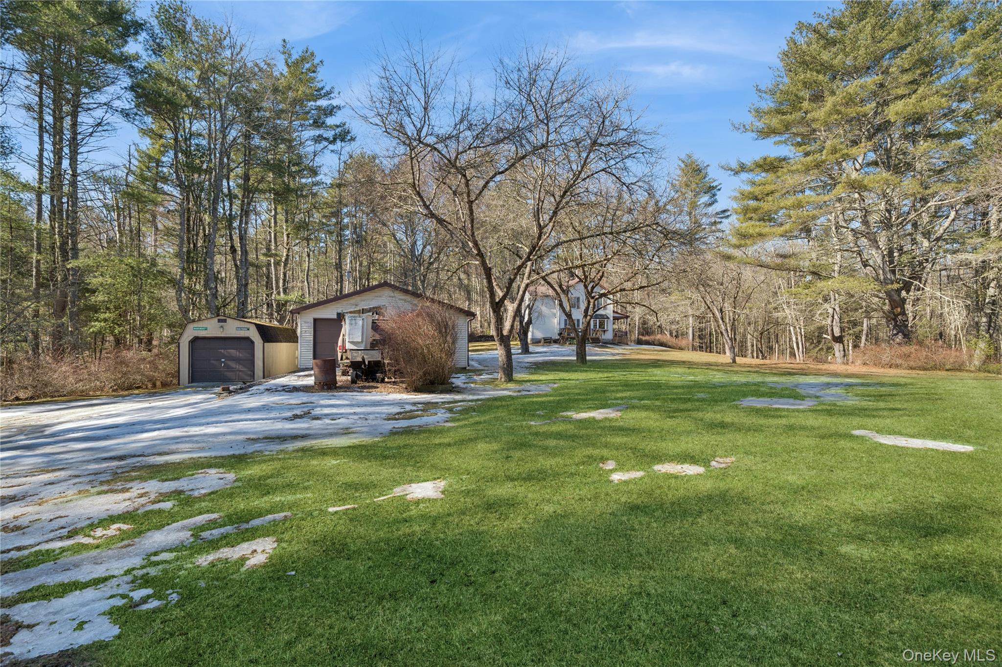 37 Nober Strunk Road Narrowsburg, NY 12764 - Photo 41 of 50 a view of a fountain in front of a house with a big yard and large trees
