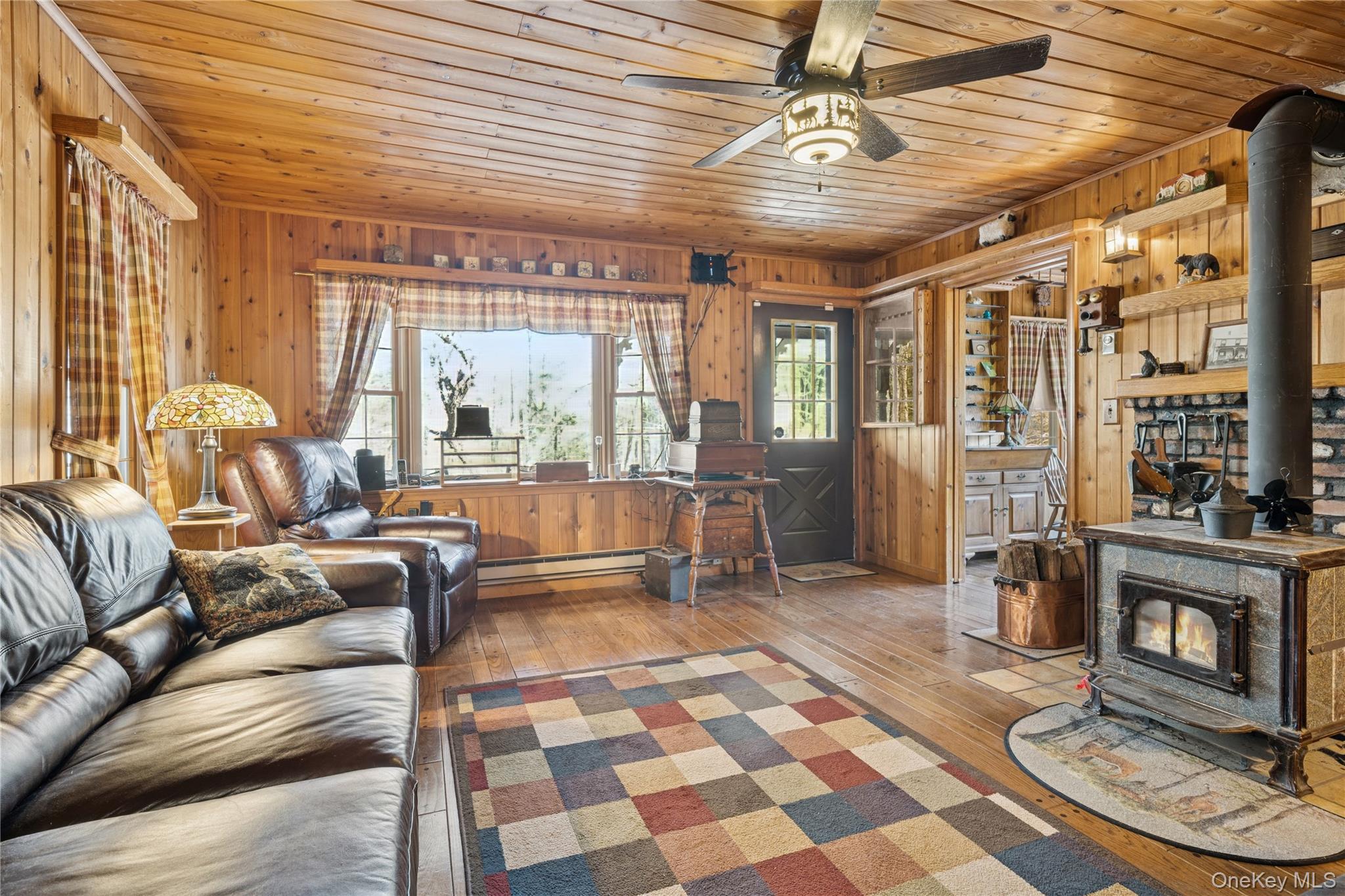 37 Nober Strunk Road Narrowsburg, NY 12764 - Photo 8 of 50 a living room with furniture and a fireplace