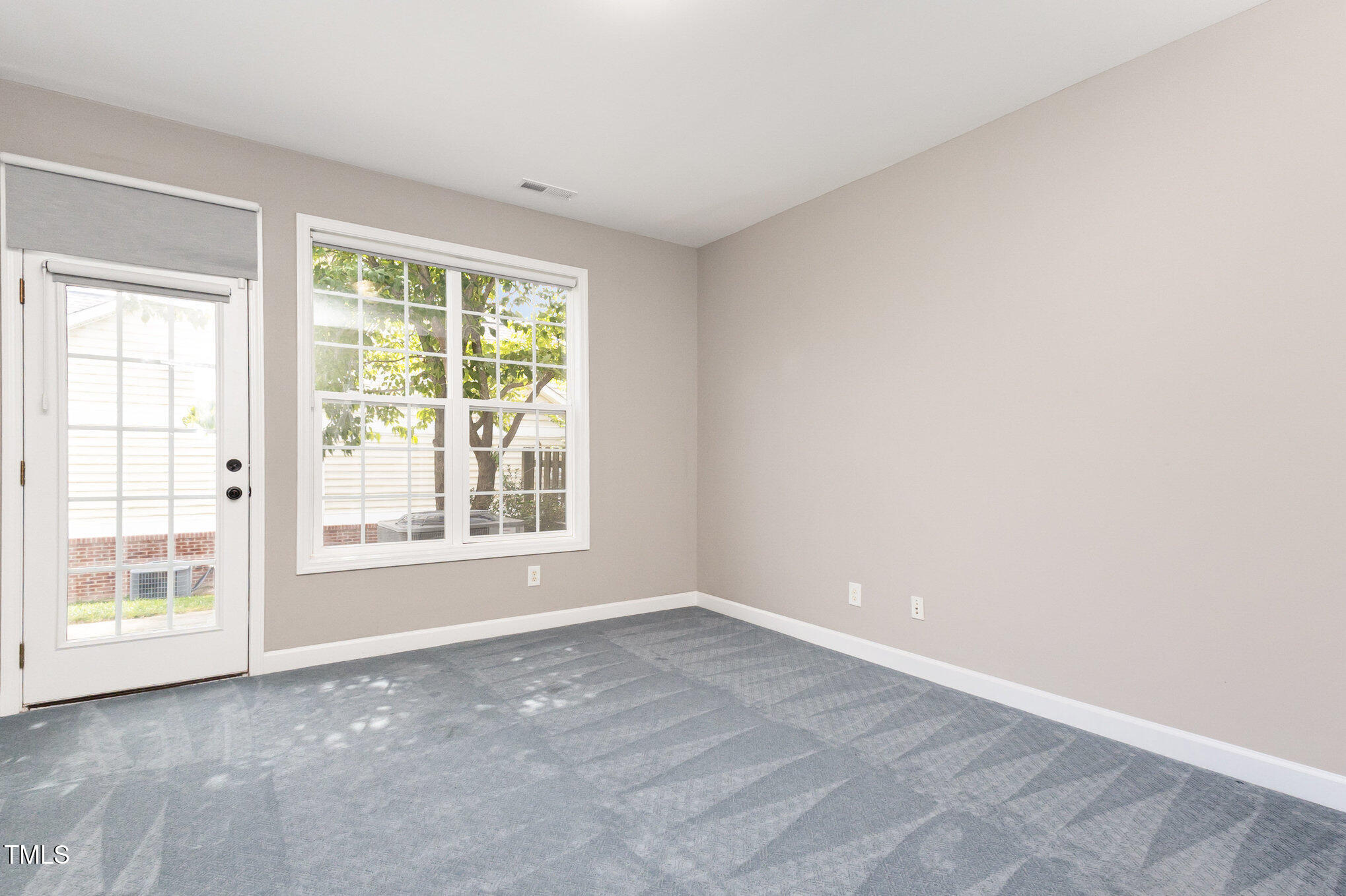 8004 Thrush Ridge Lane Raleigh, NC 27615 - Photo 15 of 34 a view of an empty room with a window