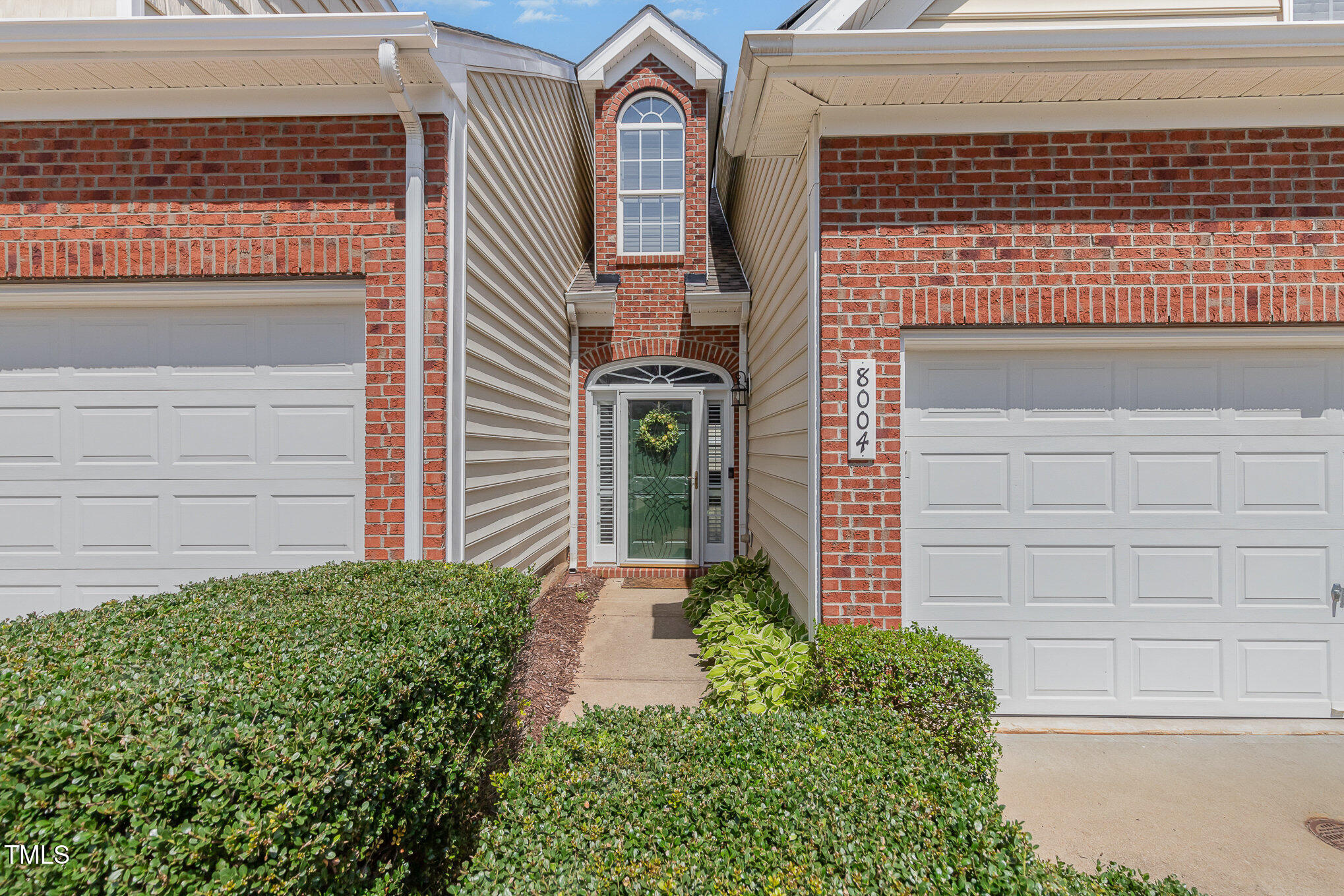 8004 Thrush Ridge Lane Raleigh, NC 27615 - Photo 3 of 34 a front view of a house with plants