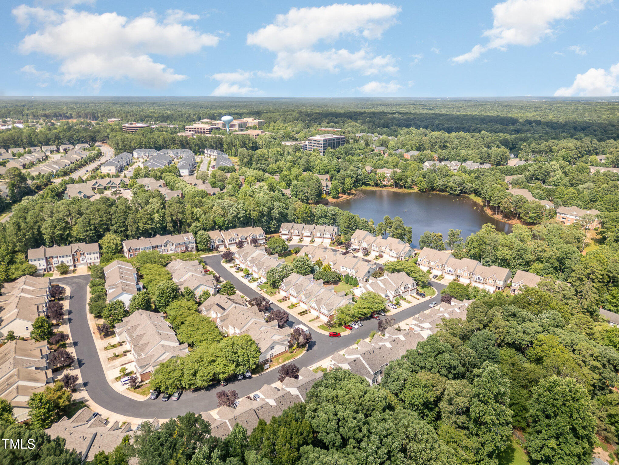 8004 Thrush Ridge Lane Raleigh, NC 27615 - Photo 32 of 34 an aerial view of a house with a lake view