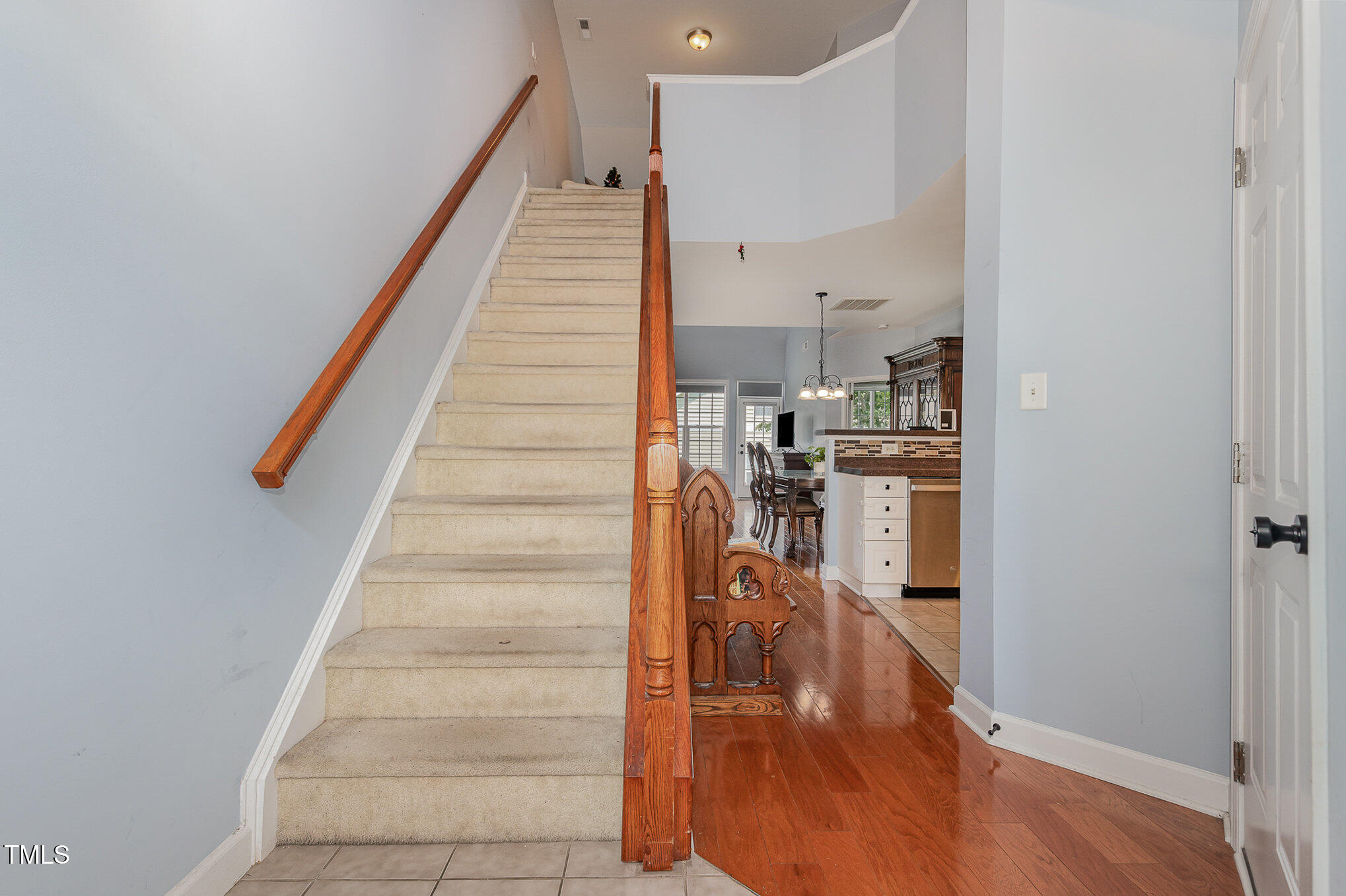 8004 Thrush Ridge Lane Raleigh, NC 27615 - Photo 5 of 34 a view of entryway and hall with wooden floor