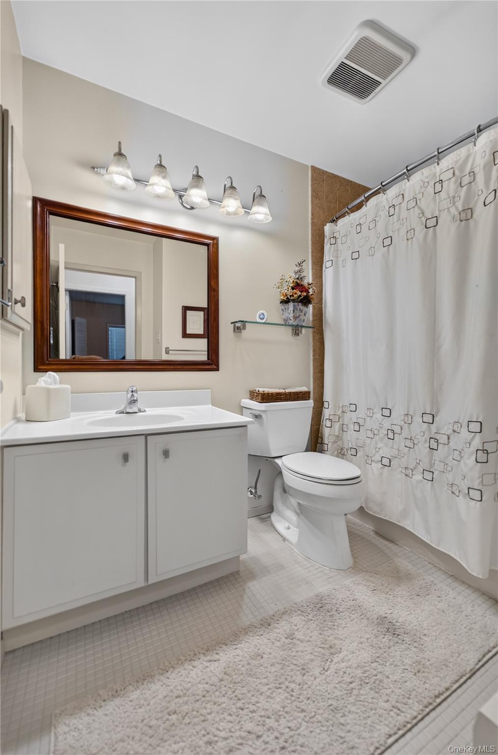 261 Hallock Road Stony Brook, NY 11790 - Photo 10 of 13 a bathroom with a sink toilet and shower