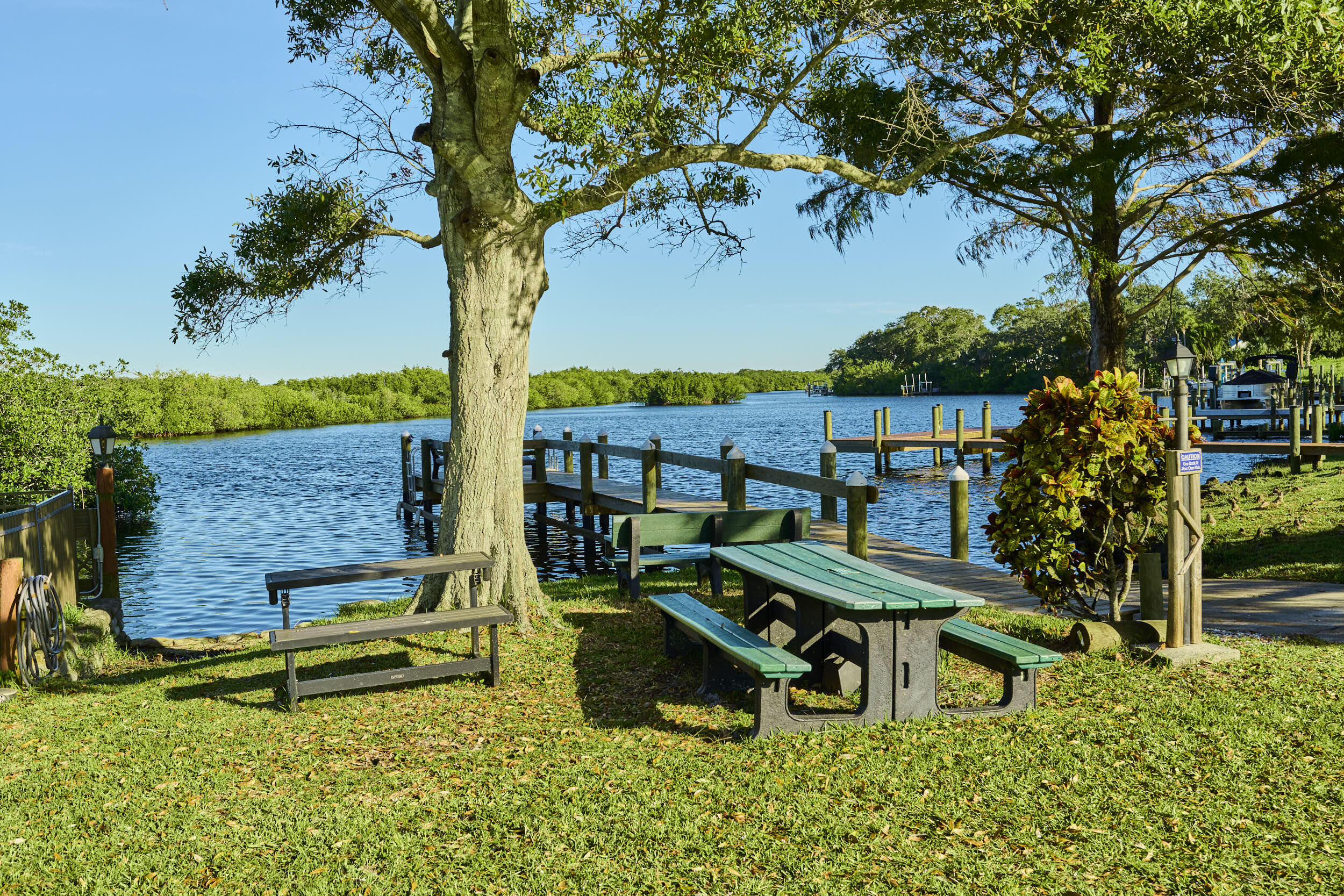 34 Sunset Drive Sebastian, FL 32958 - Photo 22 of 63 a view of a bench in the garden
