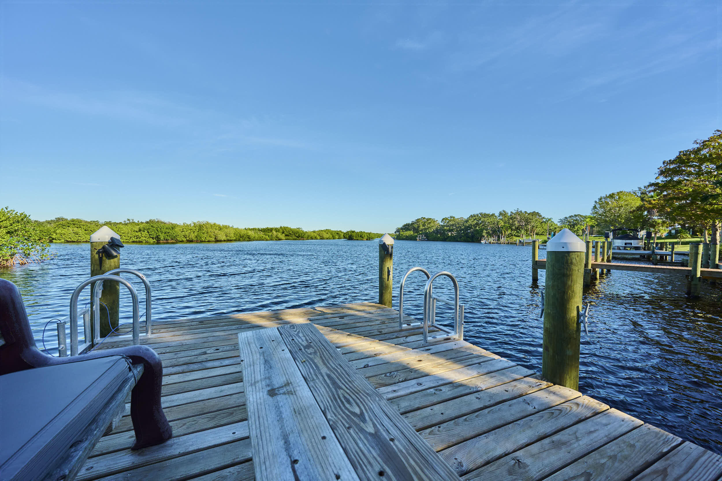 34 Sunset Drive Sebastian, FL 32958 - Photo 28 of 63 a view of a balcony with wooden floor and outdoor space