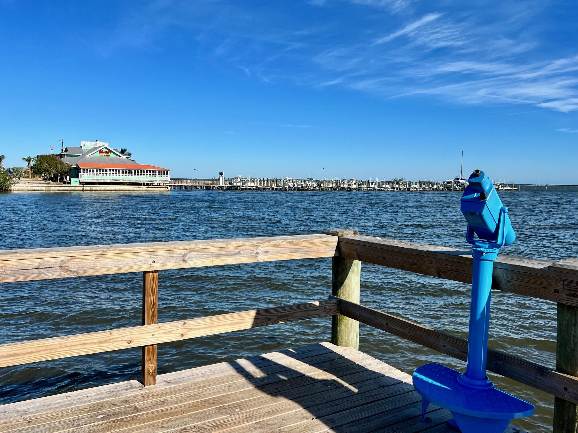 34 Sunset Drive Sebastian, FL 32958 - Photo 49 of 63 a view of a roof deck with wooden floor and fence