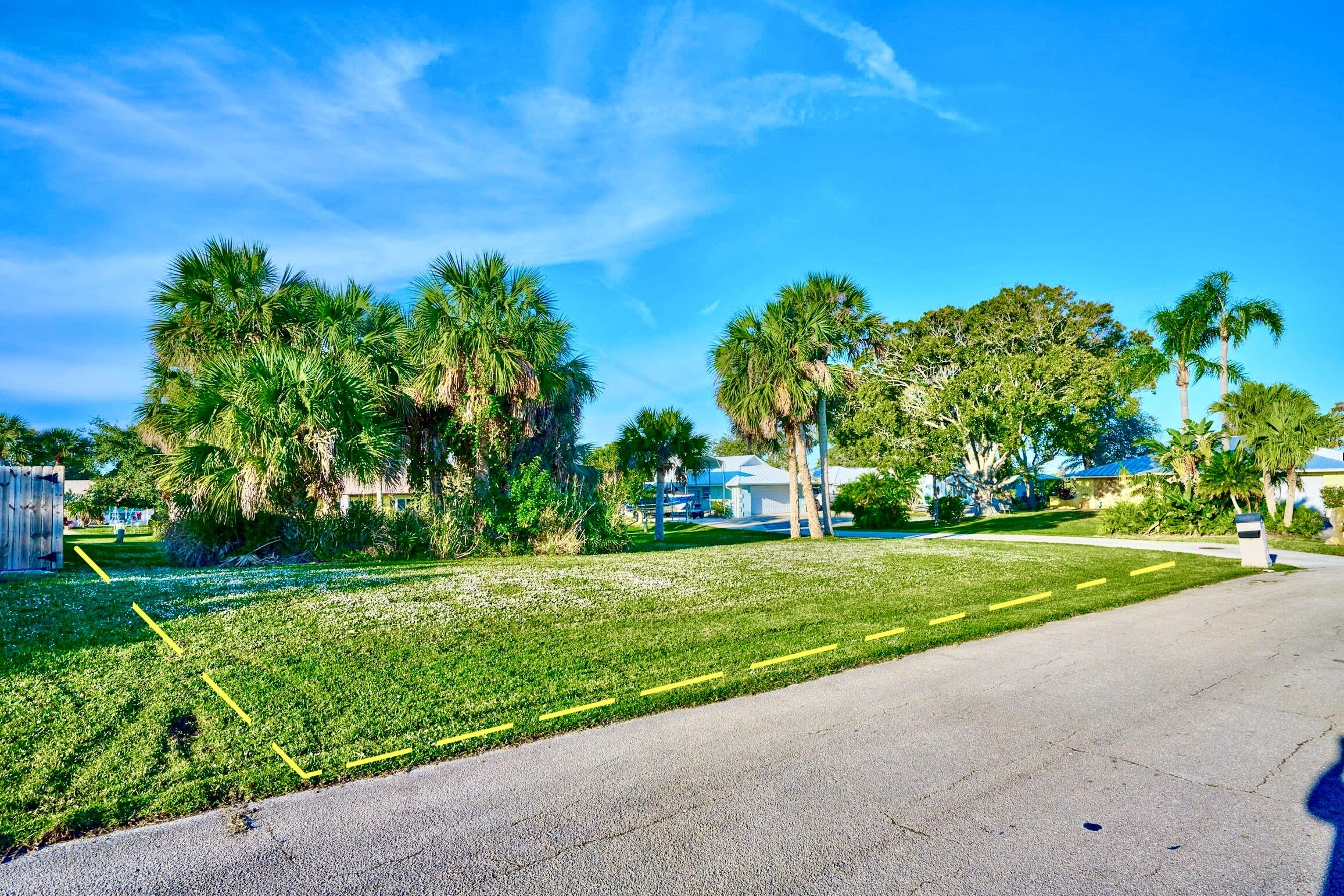 34 Sunset Drive Sebastian, FL 32958 - Photo 6 of 63 a view of a grassy field with trees