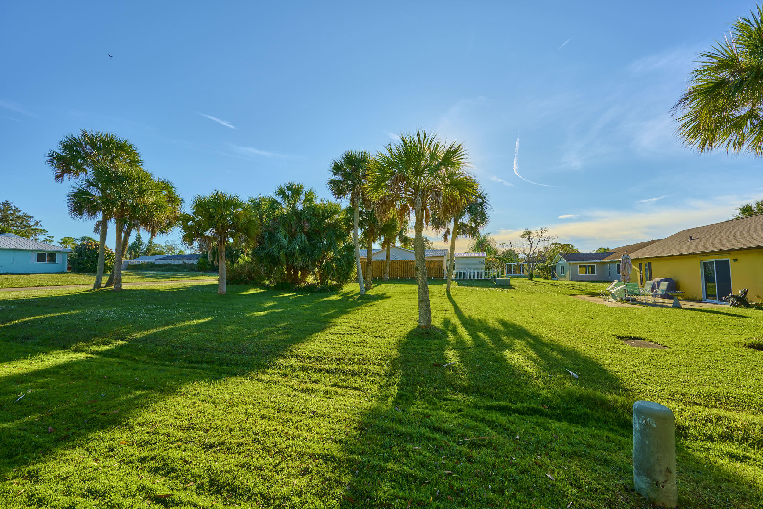 34 Sunset Drive Sebastian, FL 32958 - Photo 10 of 63 a view of a big yard with palm trees