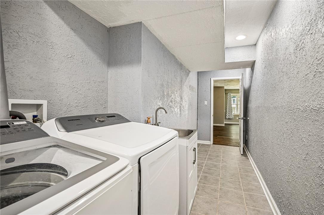 2428 Nottingham Road Bethlehem, PA 18017 - Photo 34 of 48 A well-appointed utility area featuring modern laundry appliances and a convenient utility sink.