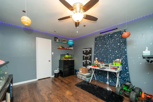 a living room with fireplace furniture and a flat screen tv