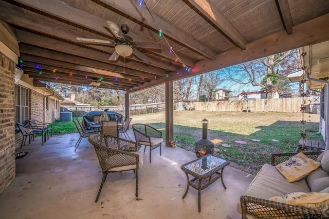 a building outdoor space with patio furniture and potted plants