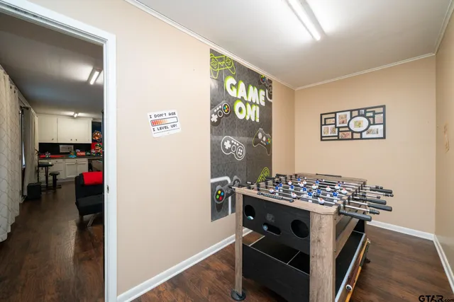 a view of kitchen space with stove and wooden cabinets