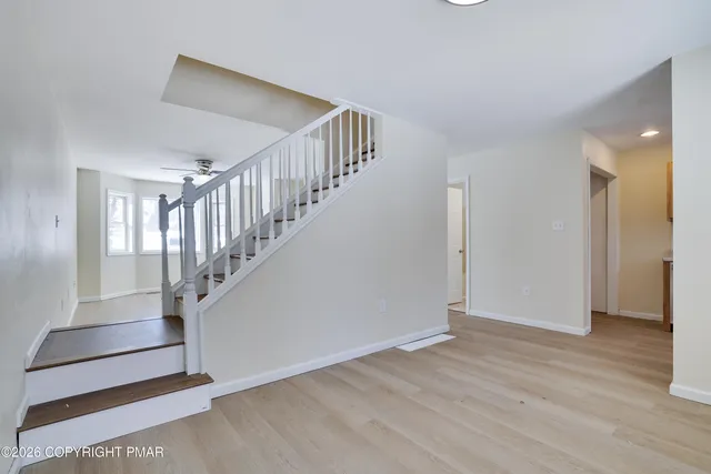 a view of entryway with wooden floor
