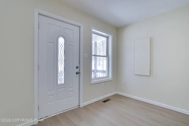 an empty room with windows