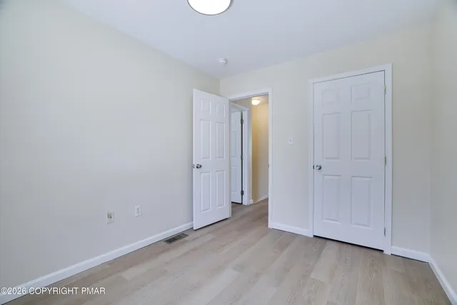 a picture of a bench in front of a door