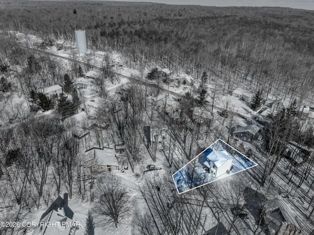 a view of a white house with a large windows