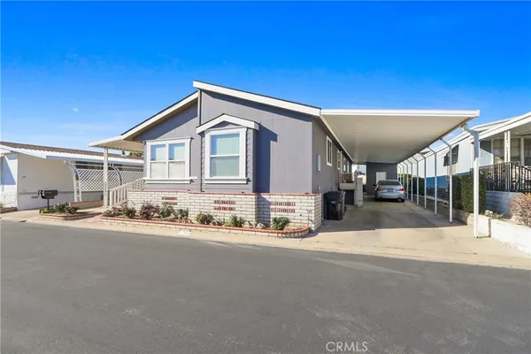 a view of a house with a street