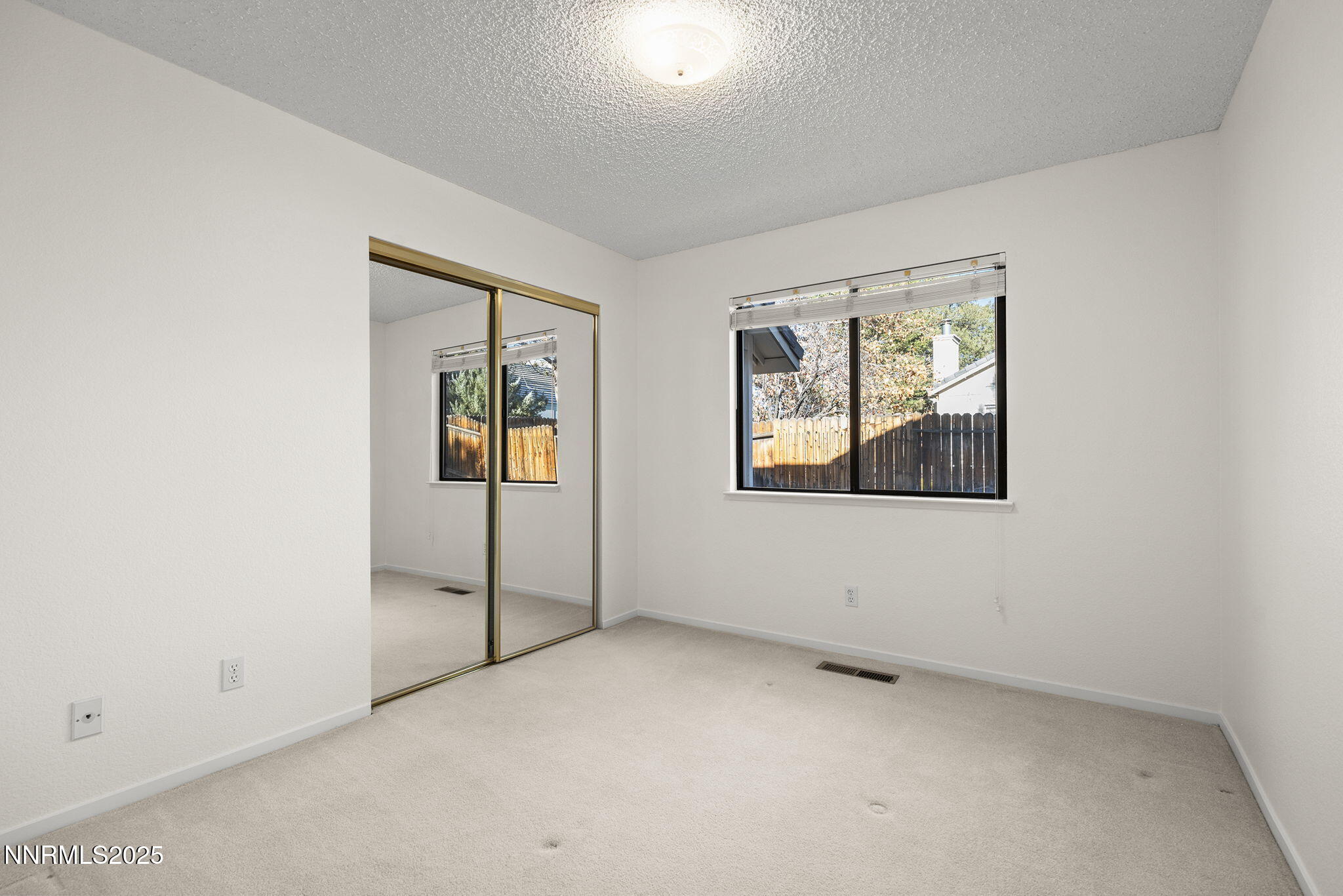 5466 Santa Rosa Avenue Sparks, NV 89436 - Photo 13 of 36 an empty room with windows
