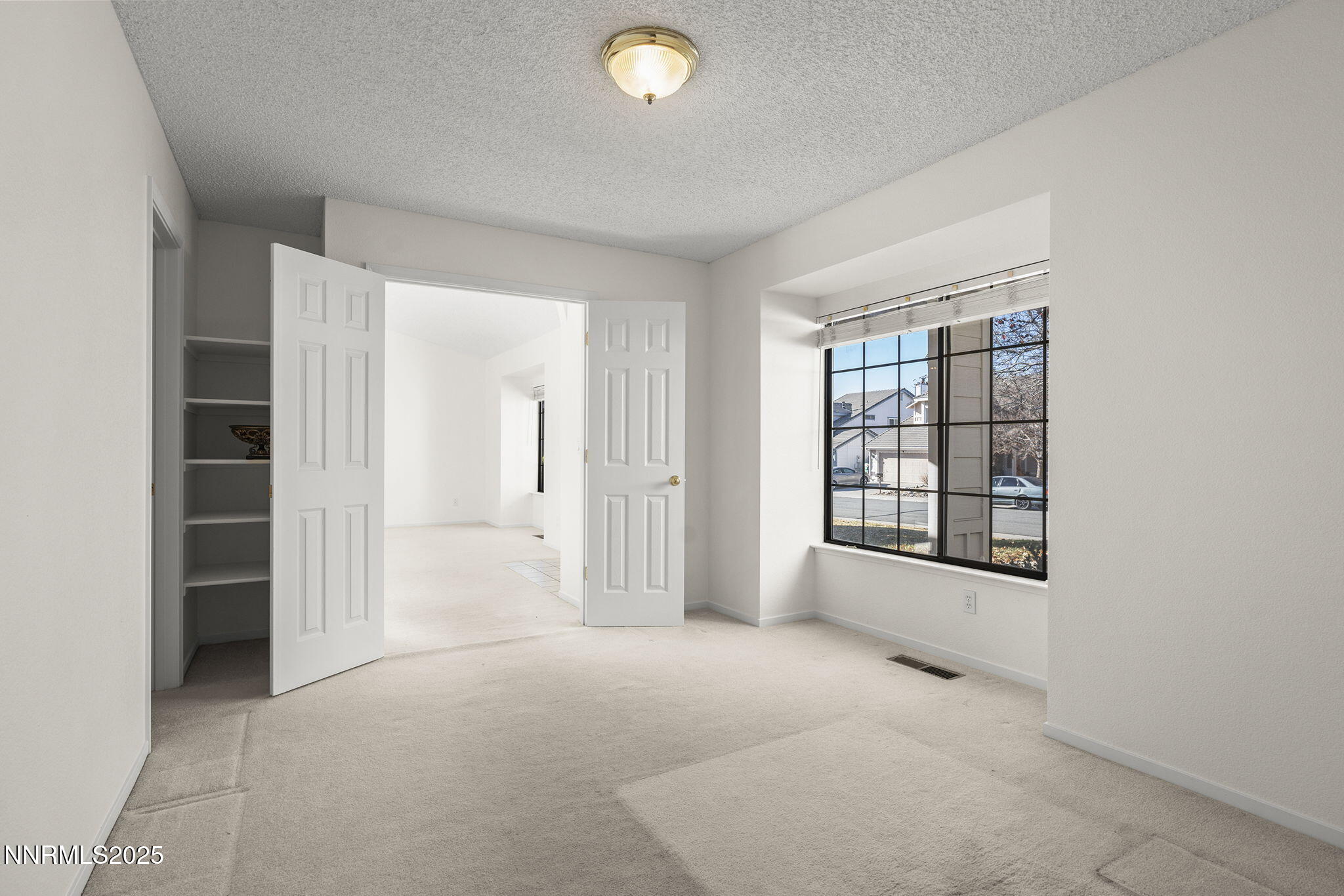 5466 Santa Rosa Avenue Sparks, NV 89436 - Photo 17 of 36 an empty room with windows and closet