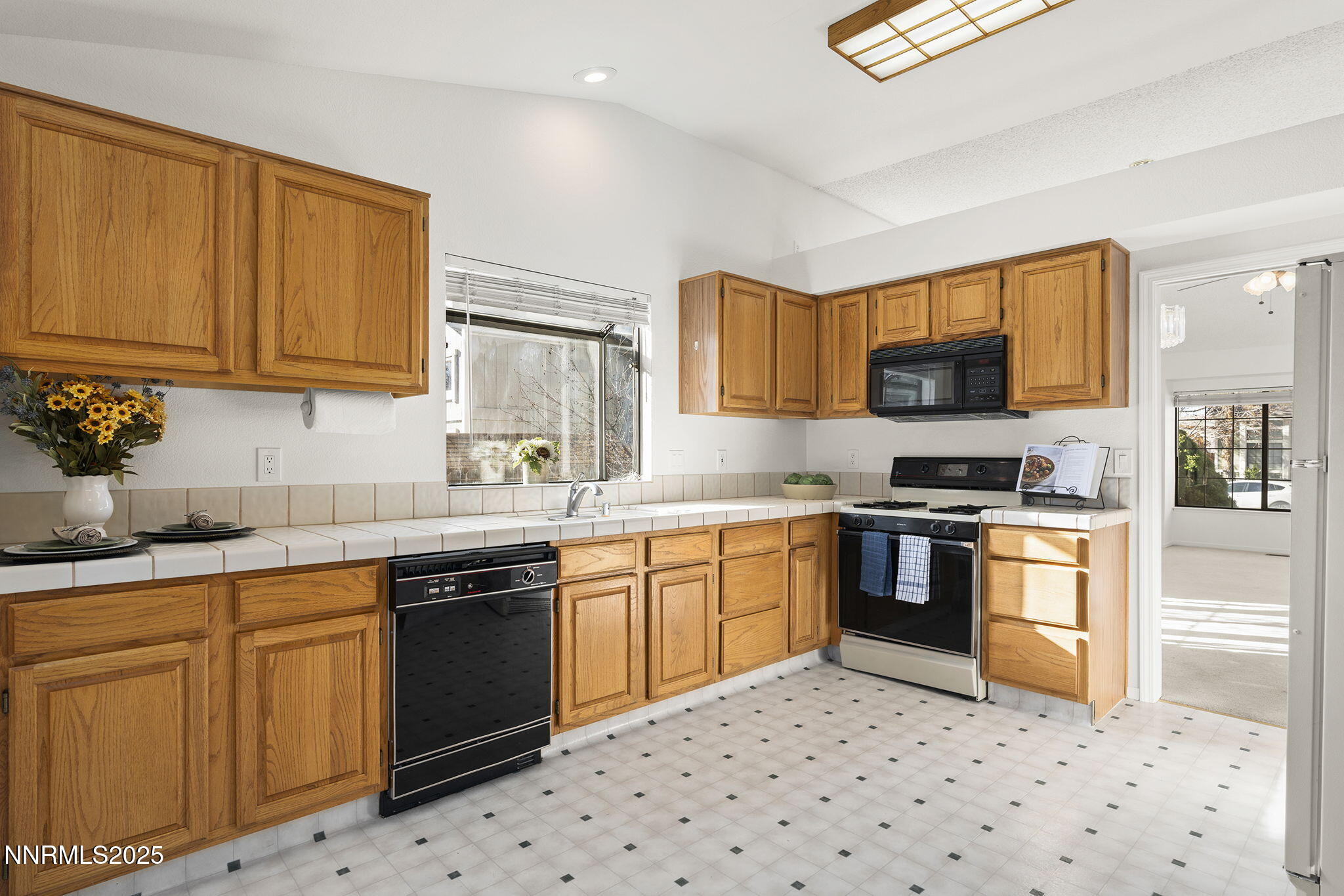 5466 Santa Rosa Avenue Sparks, NV 89436 - Photo 21 of 36 a kitchen with granite countertop appliances a sink and cabinets