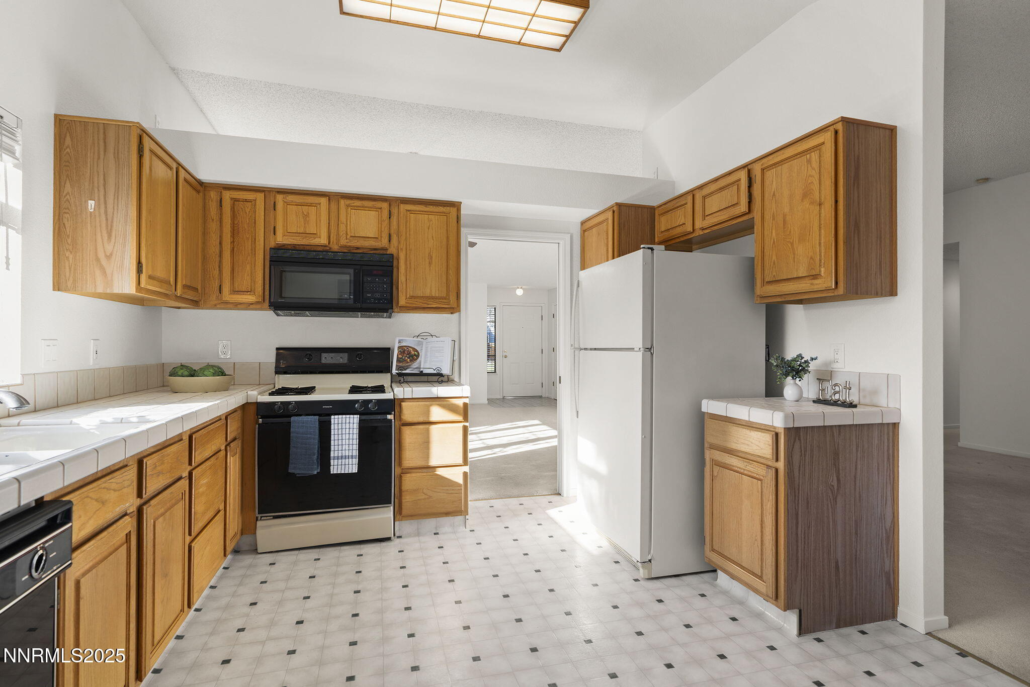 5466 Santa Rosa Avenue Sparks, NV 89436 - Photo 22 of 36 a kitchen with stainless steel appliances a refrigerator stove and sink