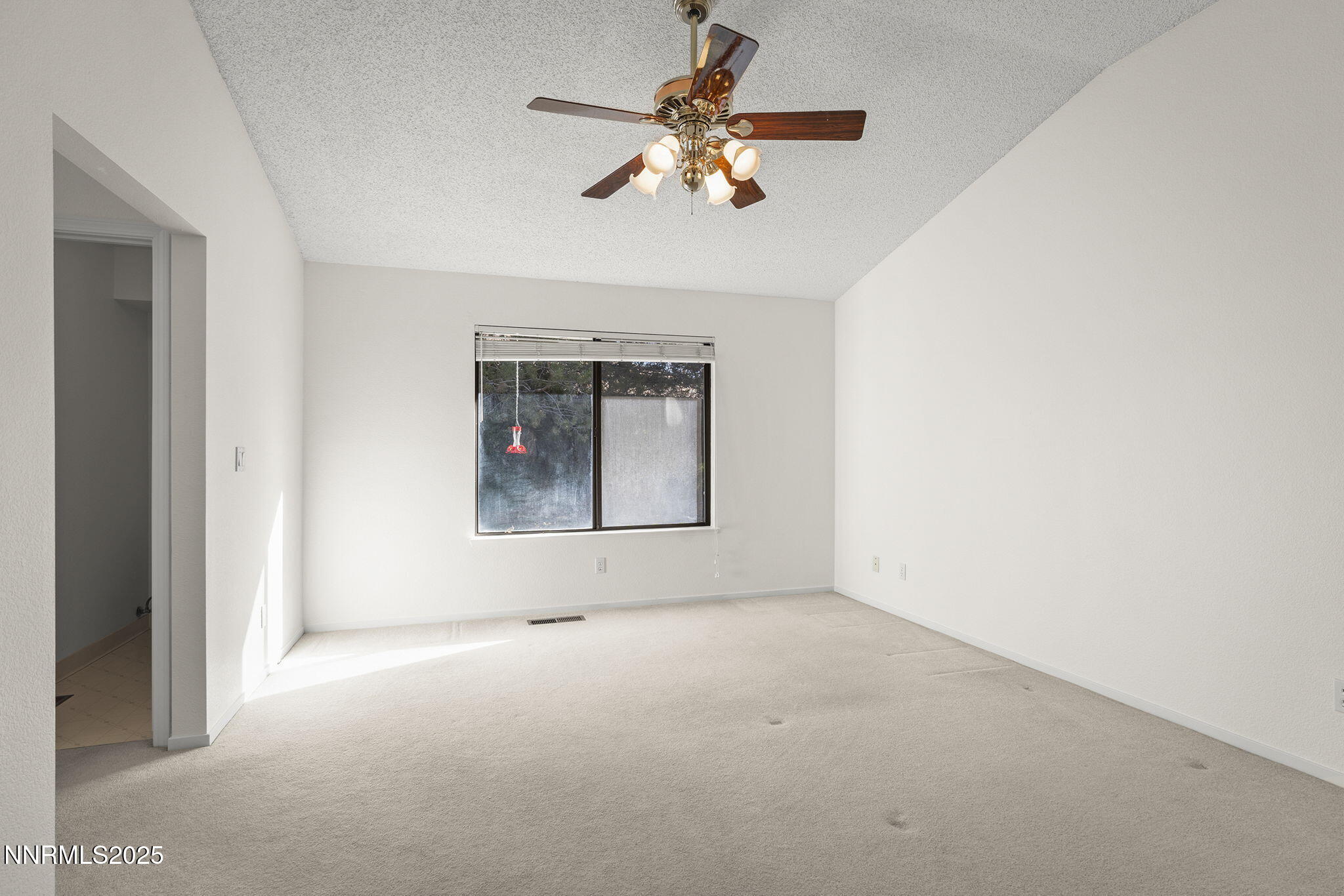 5466 Santa Rosa Avenue Sparks, NV 89436 - Photo 24 of 36 a view of an empty room with a window