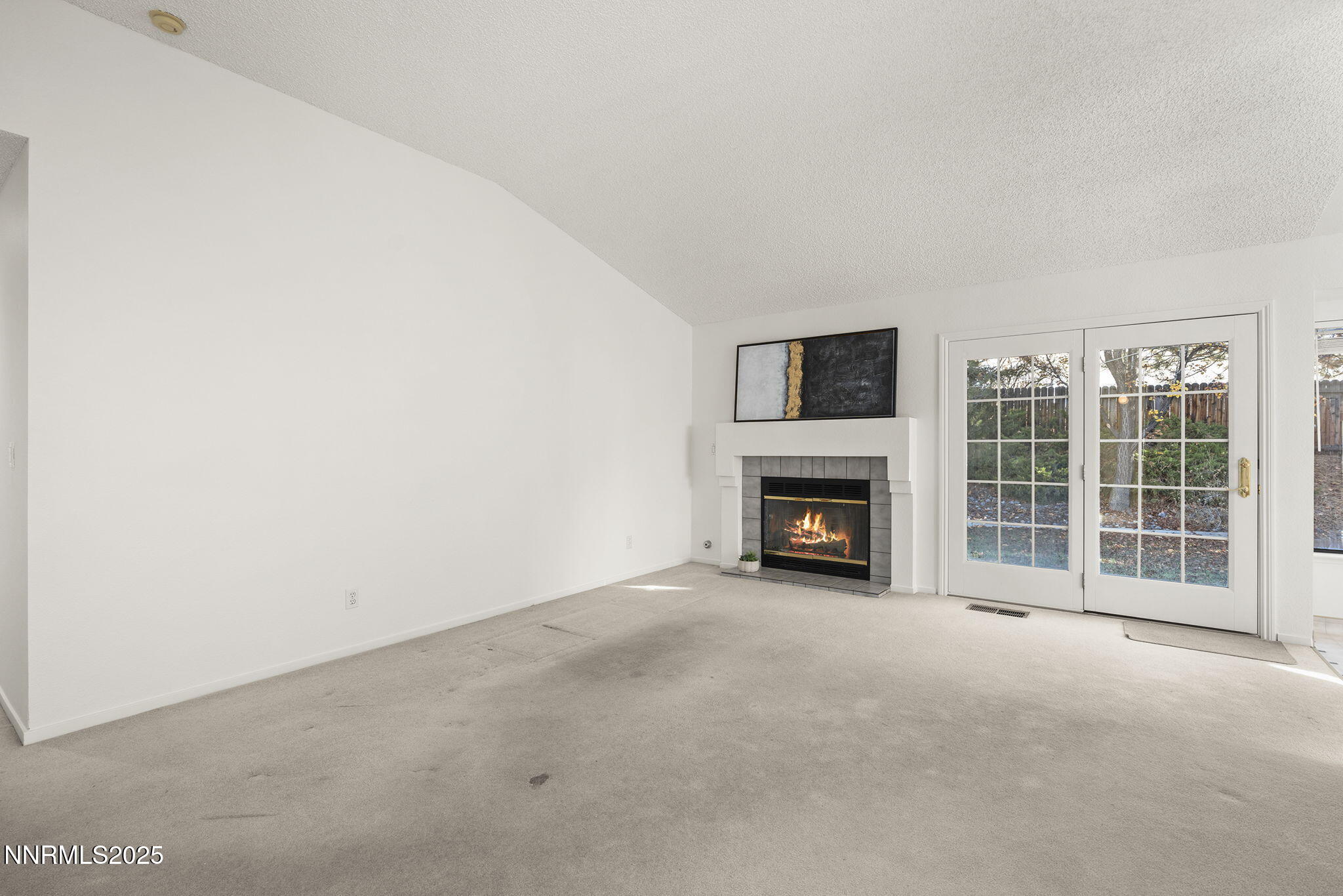 5466 Santa Rosa Avenue Sparks, NV 89436 - Photo 32 of 36 a view of a livingroom with a fireplace and a large window