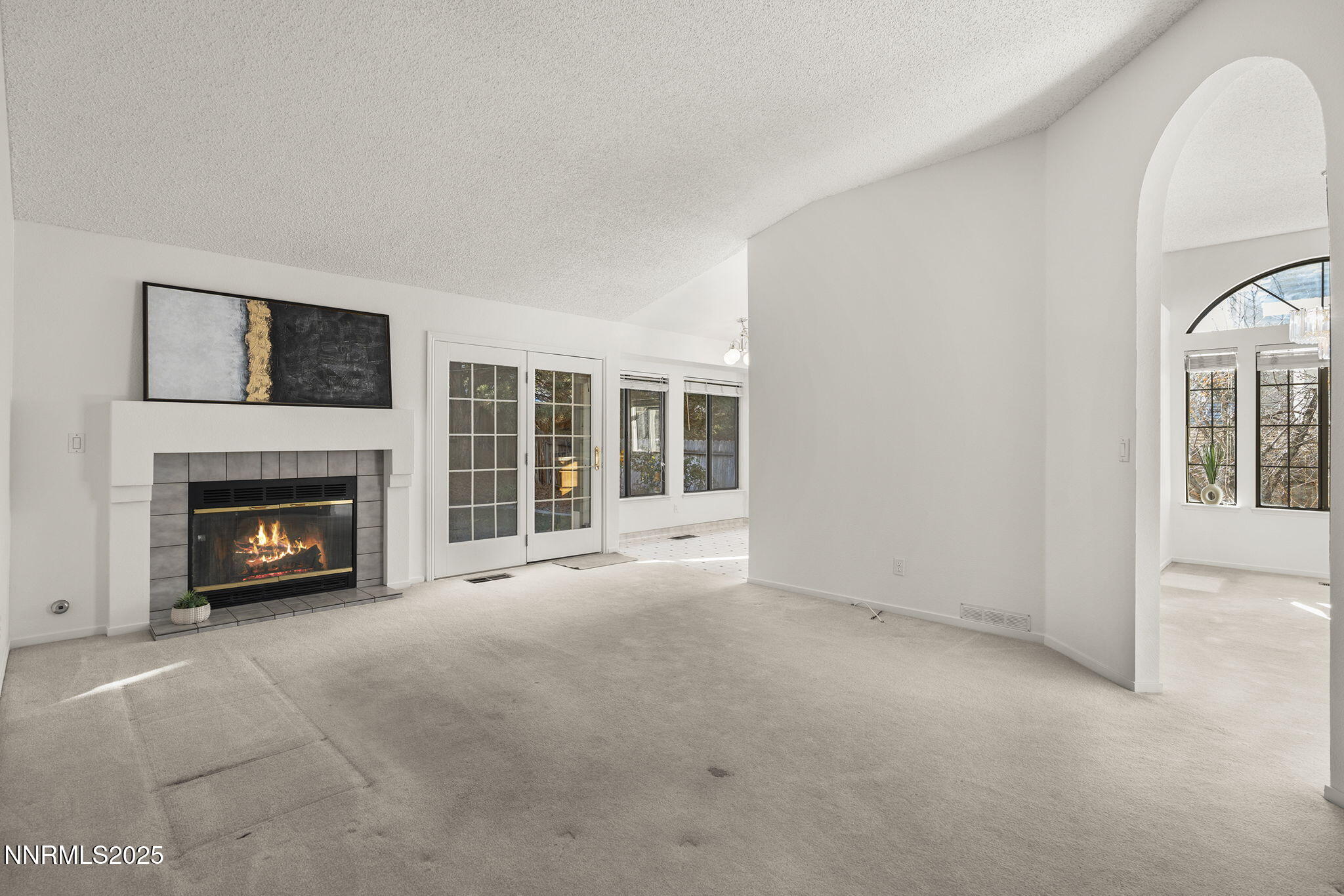 5466 Santa Rosa Avenue Sparks, NV 89436 - Photo 33 of 36 a view of an empty room with a fireplace and a window