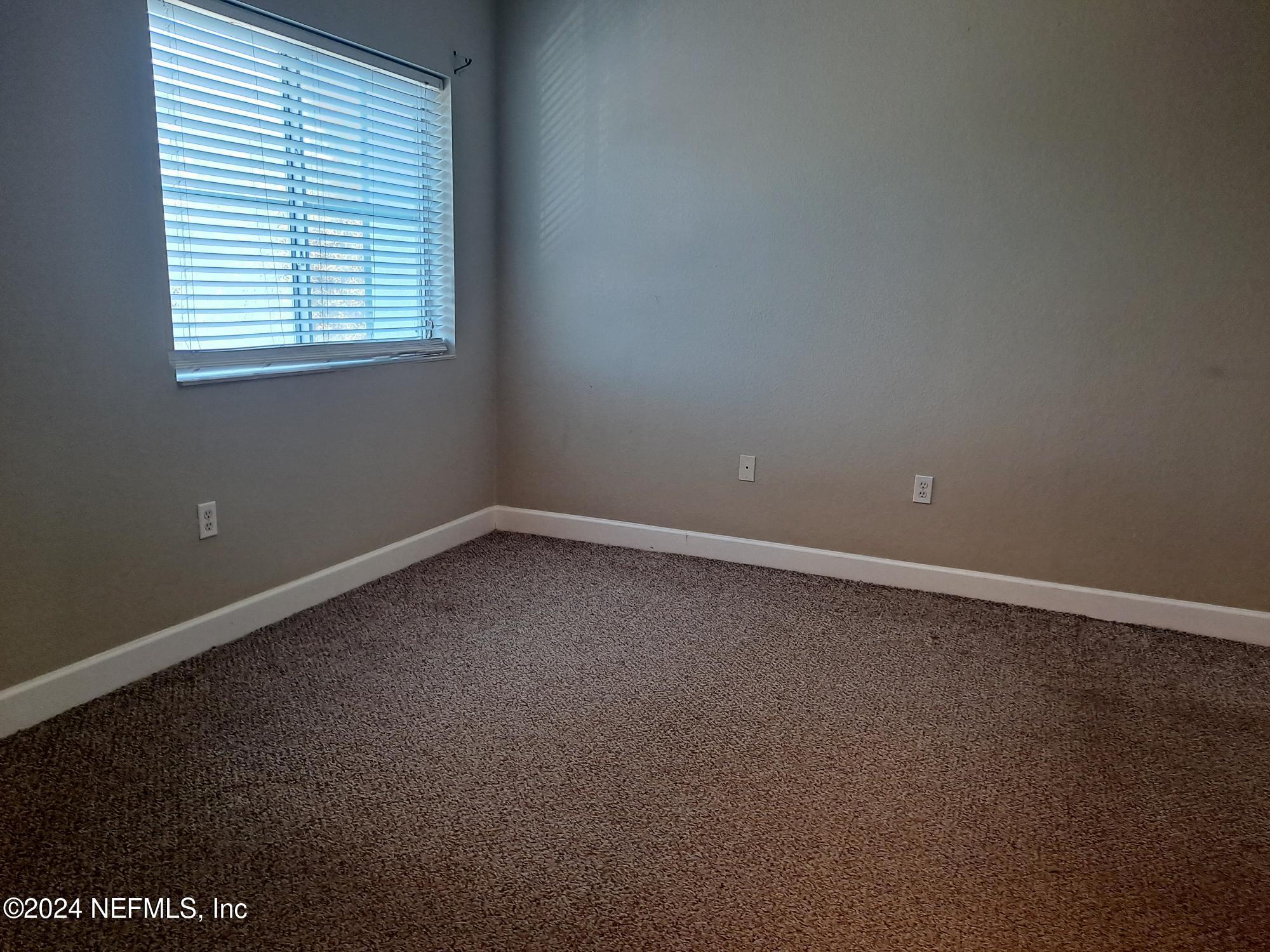 9745 Touchton Road, Unit 927 Jacksonville, FL 32246 - Photo 15 of 22 an empty room with a window