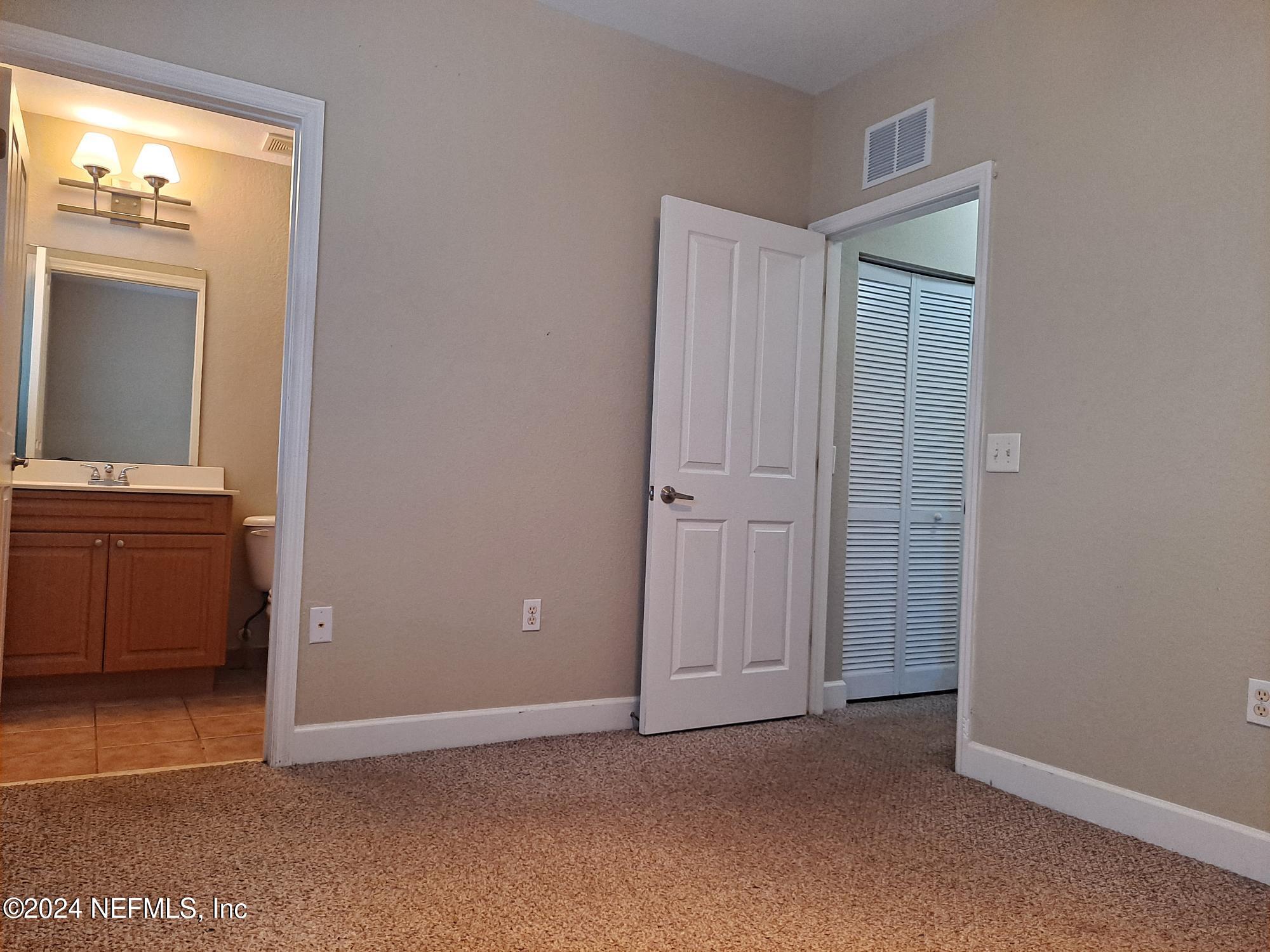 9745 Touchton Road, Unit 927 Jacksonville, FL 32246 - Photo 21 of 22 a view of an empty room with a bathroom