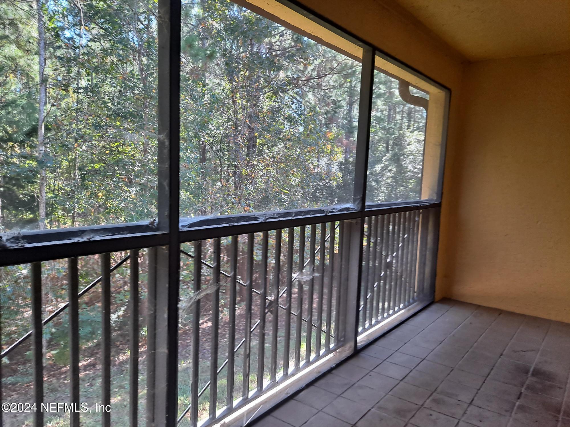 9745 Touchton Road, Unit 927 Jacksonville, FL 32246 - Photo 10 of 22 a view of a balcony with wooden floor