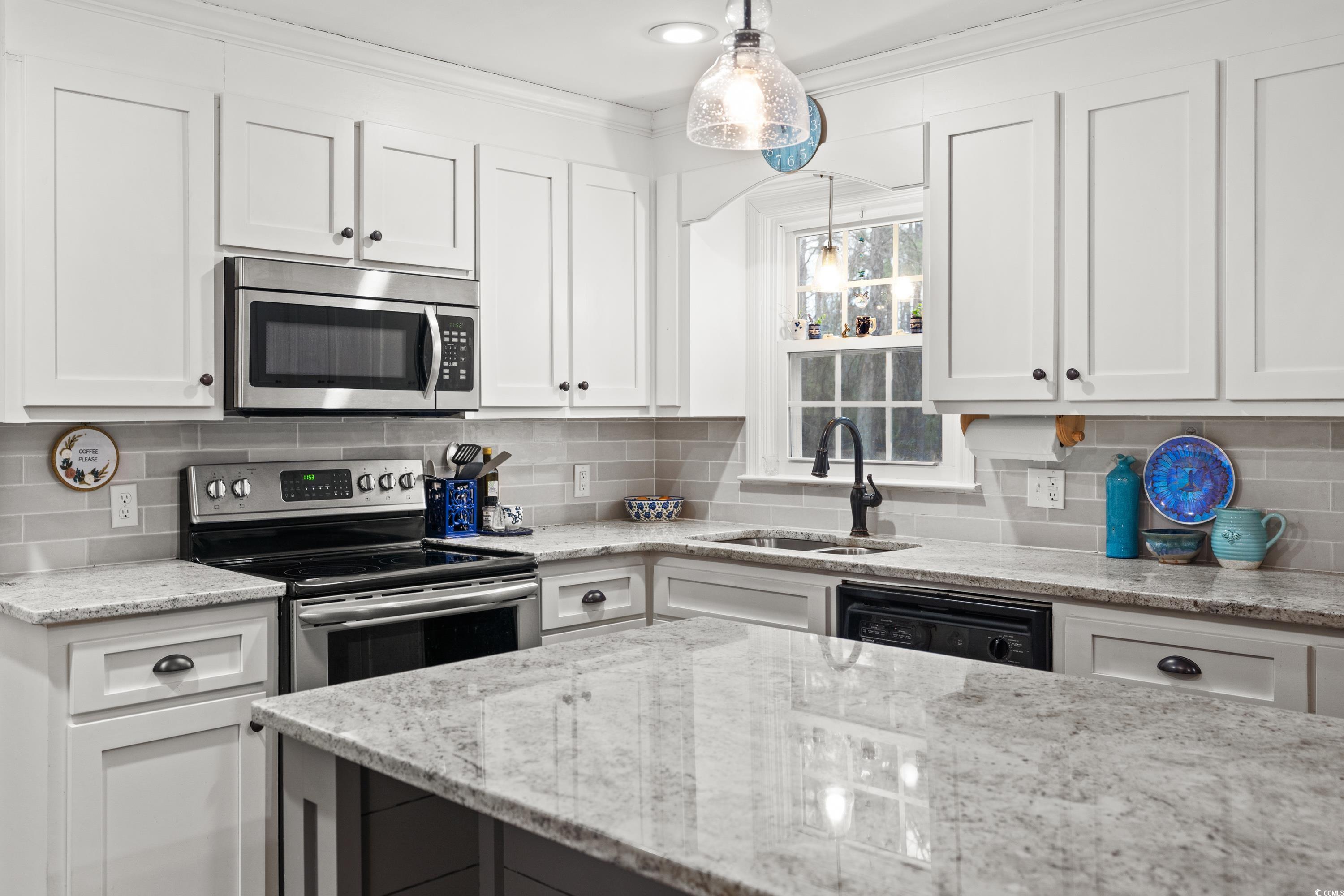 3696 Sandy Bay Road Kingstree, SC 29556 - Photo 16 of 40 Kitchen with pendant lighting, sink, appliances wi