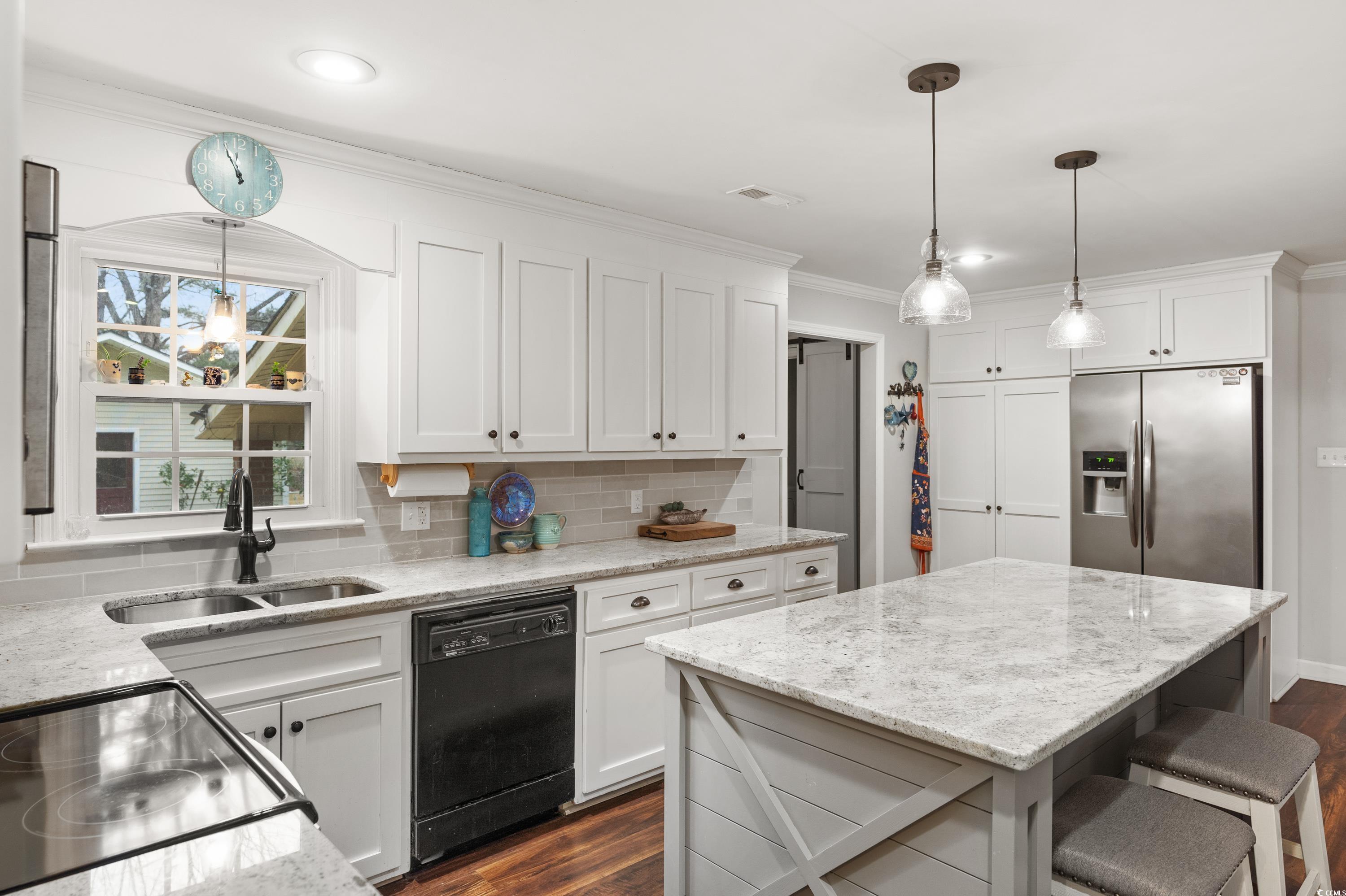3696 Sandy Bay Road Kingstree, SC 29556 - Photo 19 of 40 Kitchen with sink, a center island, hanging light
