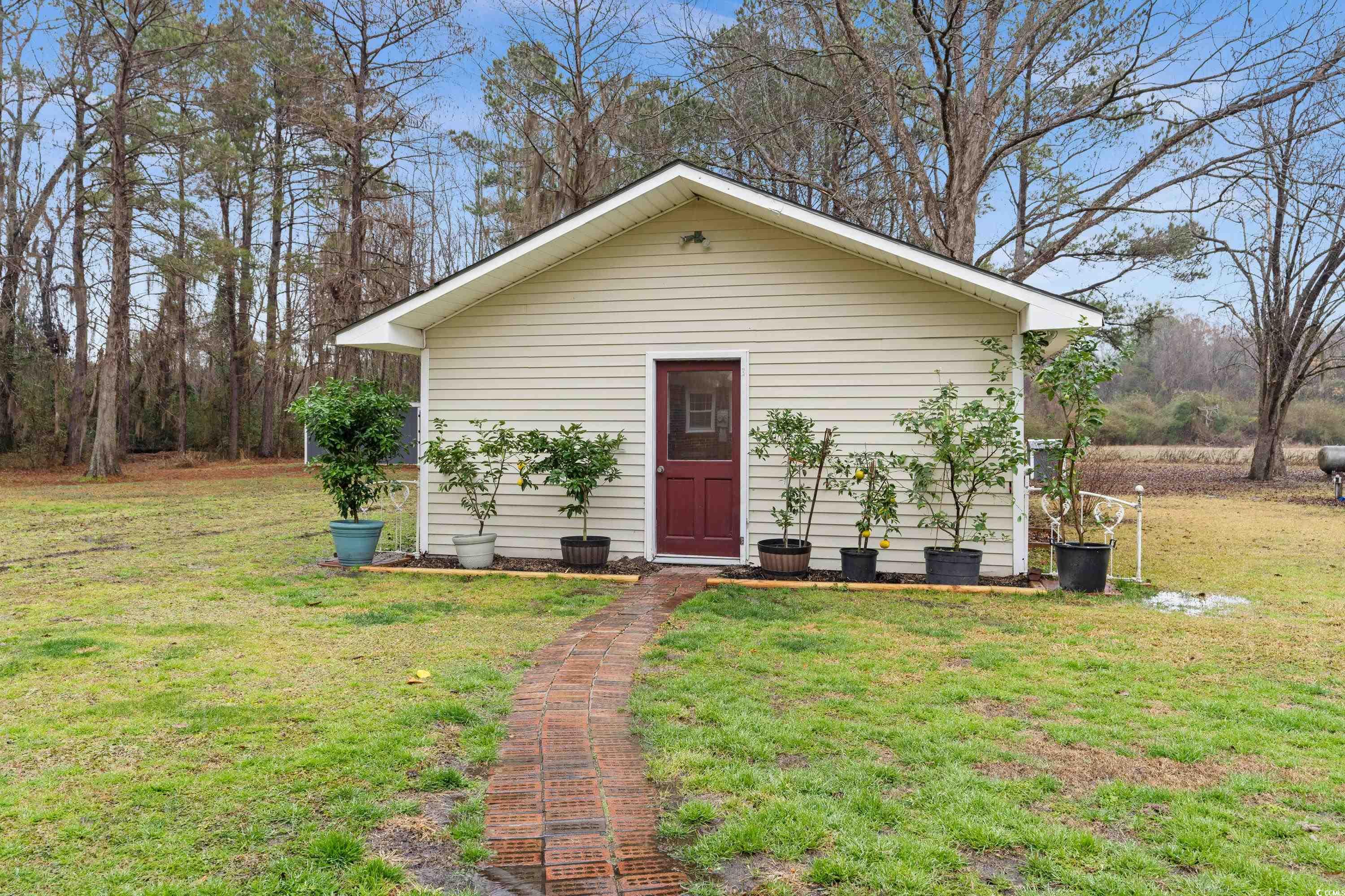 3696 Sandy Bay Road Kingstree, SC 29556 - Photo 40 of 40 View of outdoor structure with a yard