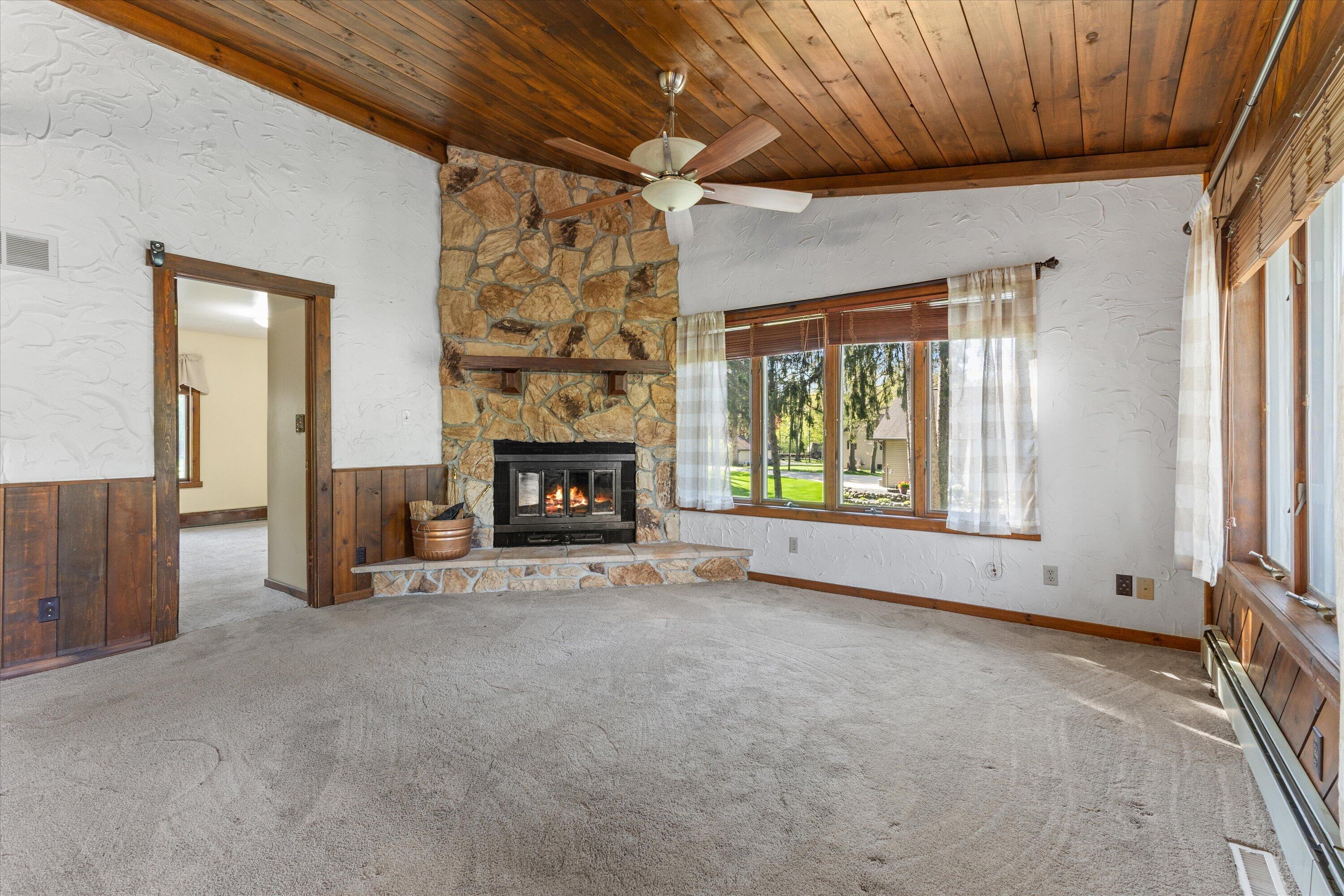 S108W34703 Jacks Bay Road Mukwonago, WI 53149 - Photo 14 of 61 Spacious Living Room with fireplace