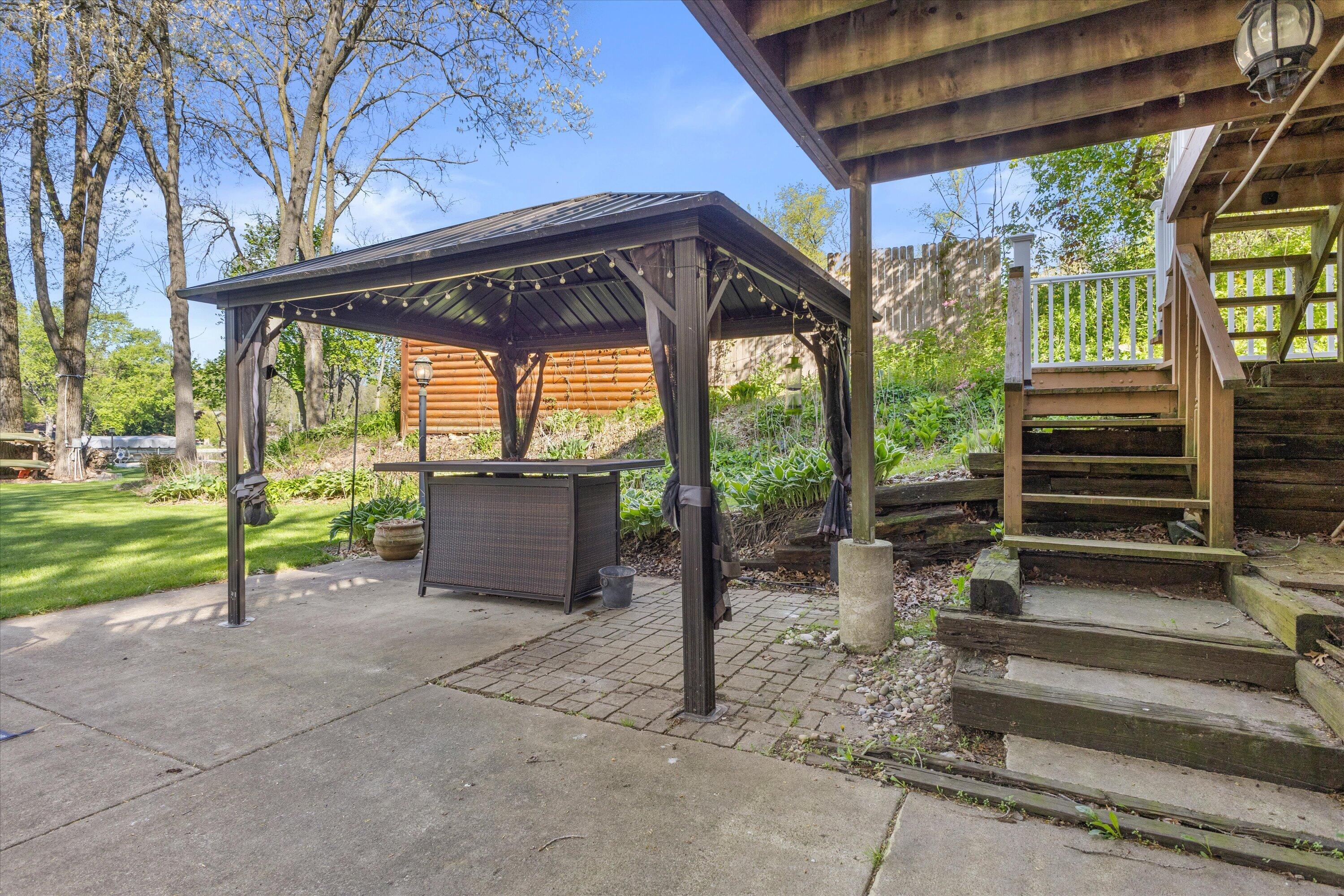 S108W34703 Jacks Bay Road Mukwonago, WI 53149 - Photo 41 of 61 Your pergola with a fire table!