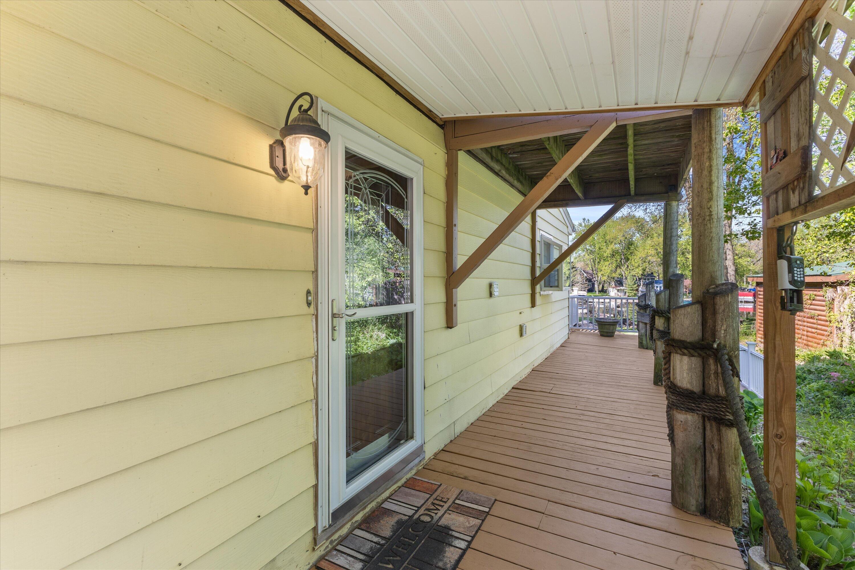 S108W34703 Jacks Bay Road Mukwonago, WI 53149 - Photo 44 of 61 Front Door wrap around deck