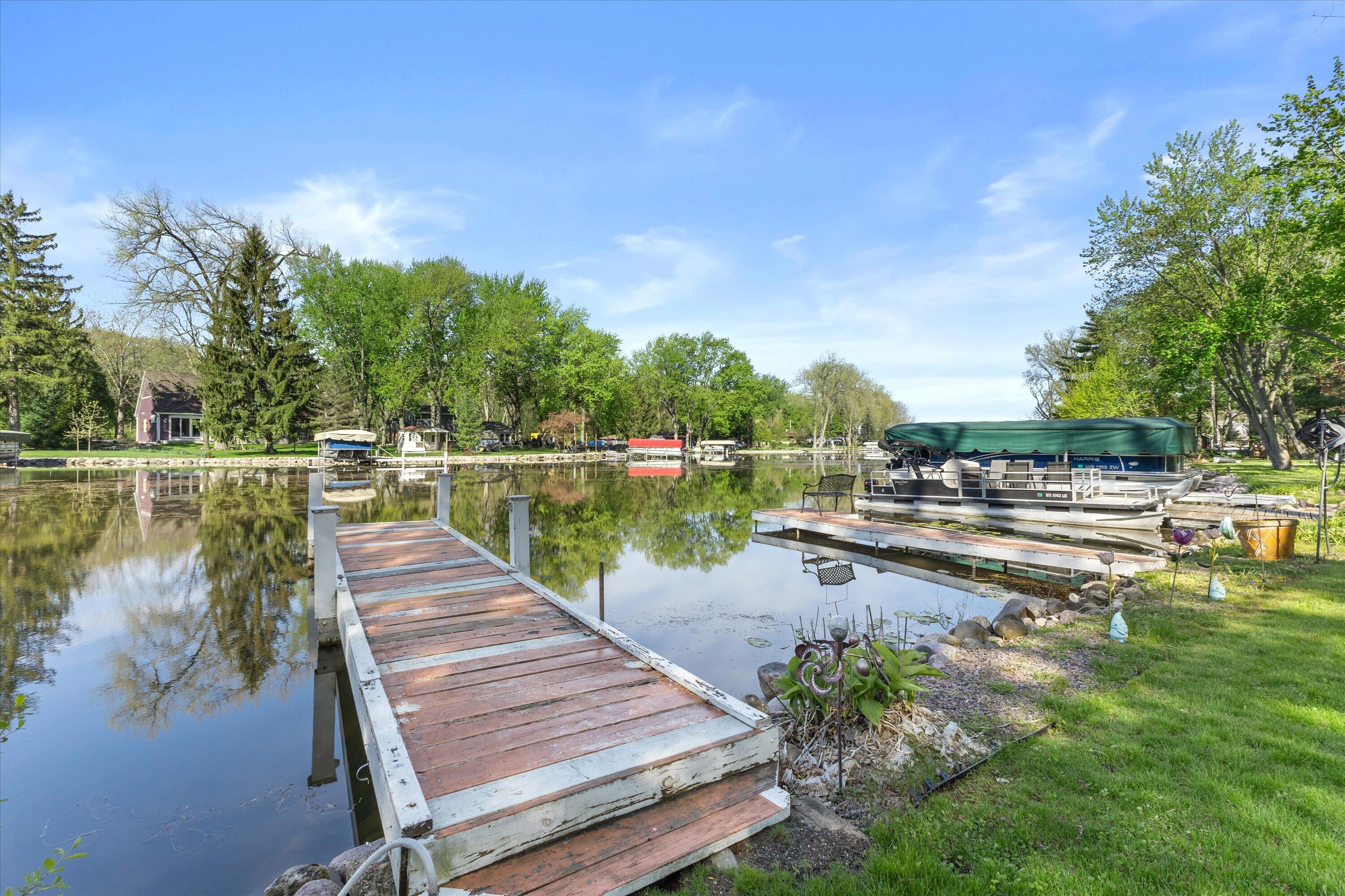S108W34703 Jacks Bay Road Mukwonago, WI 53149 - Photo 5 of 61 2 piers waiting for your boat to dock