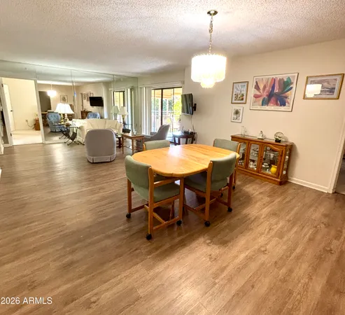 a view of a dining room with furniture window and wooden floor