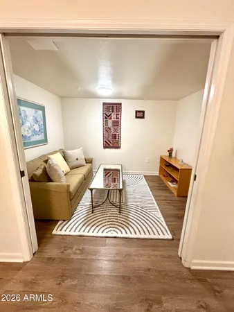 a living room with furniture and a rug