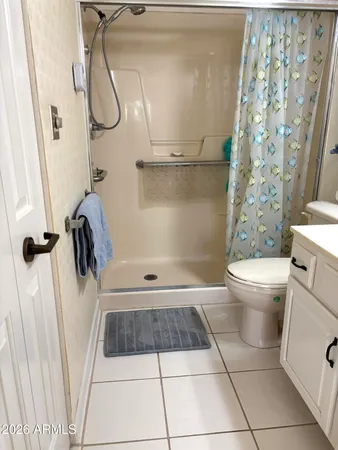 a bathroom with a shower and a toilet