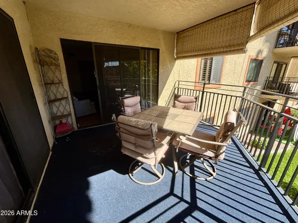 a view of a hallway with seating space