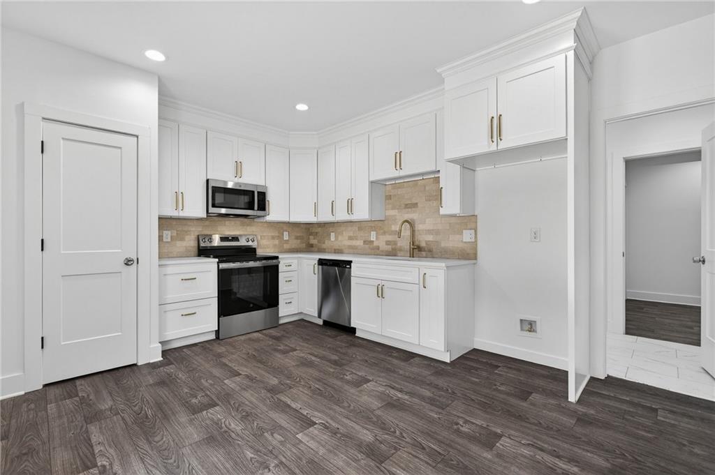 88 Carolyn Path Rockmart, GA 30153 - Photo 51 of 73 a kitchen with white cabinets and white appliances