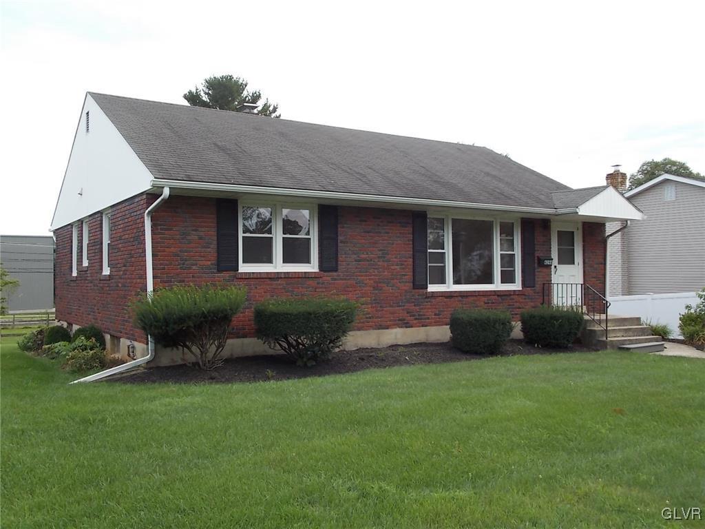 4244 Briarcliff Road Allentown, PA 18104 - Photo 2 of 13 a backyard of a house with potted plants and large tree