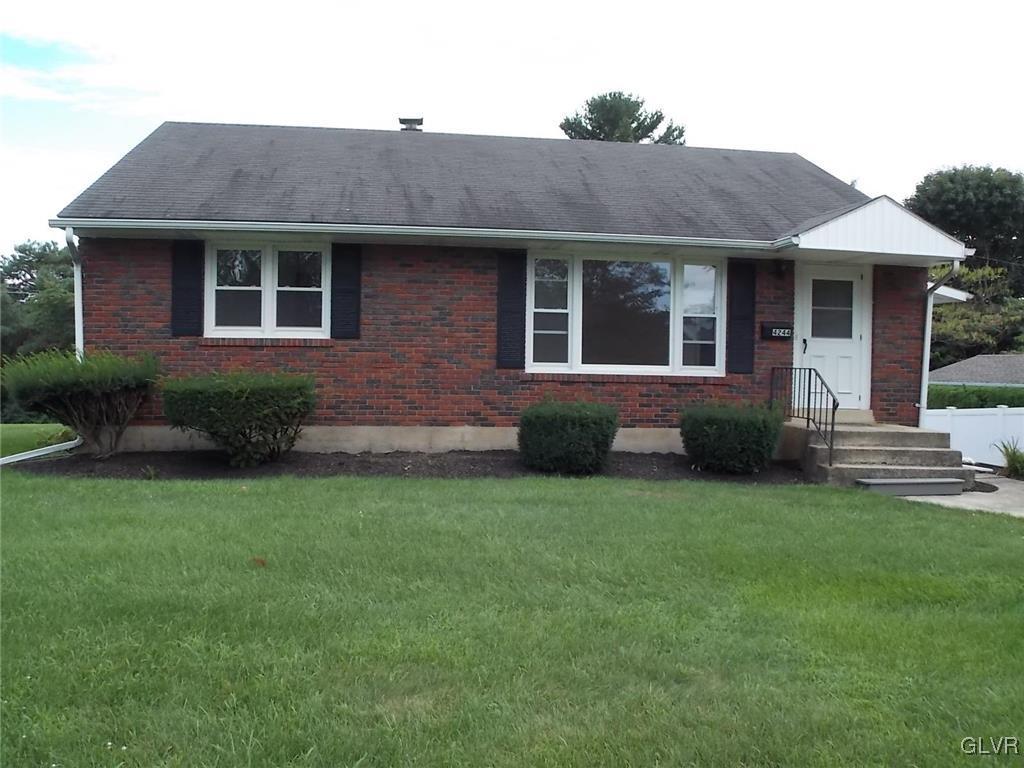 4244 Briarcliff Road Allentown, PA 18104 - Photo 3 of 13 a front view of a house with a yard and porch