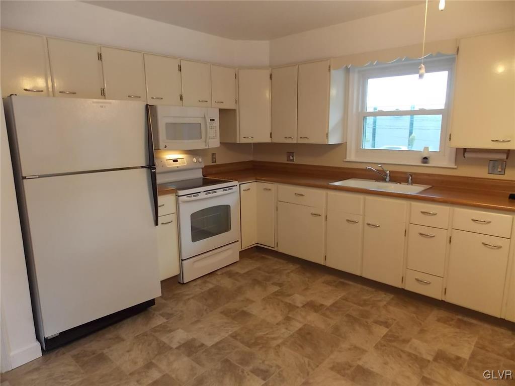 4244 Briarcliff Road Allentown, PA 18104 - Photo 5 of 13 a white refrigerator freezer sitting in a kitchen
