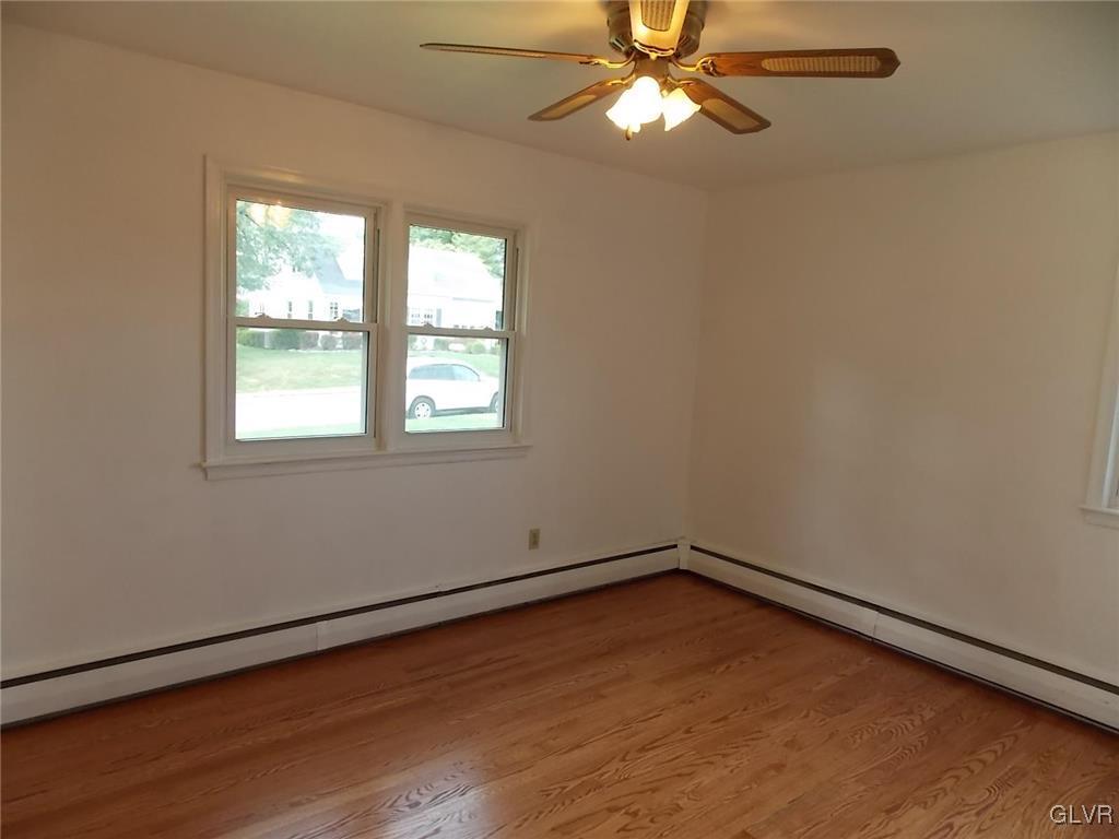 4244 Briarcliff Road Allentown, PA 18104 - Photo 9 of 13 an empty room with a window and a fan