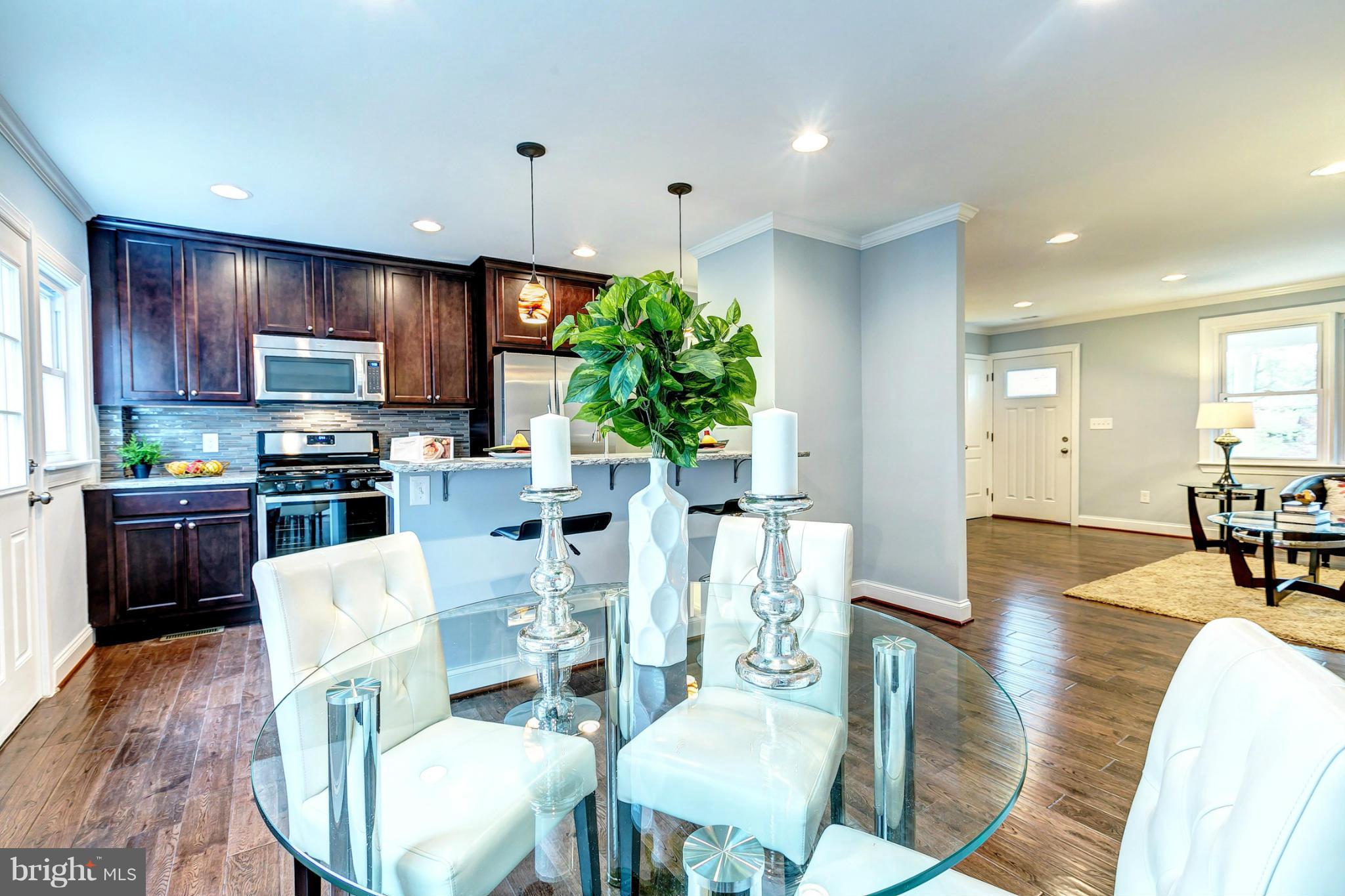 3926 Yolando Road Baltimore, MD 21218 - Photo 1 of 29 a view of a dining room with furniture window and wooden floor