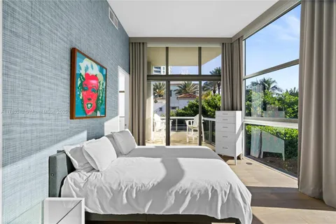 a bedroom with furniture and a bed